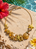 Collier Océane coloris jaune — collier plastron doré orné de coquillages, étoiles de mer et perles nacrées, émail jaune soleil, acier inoxydable
